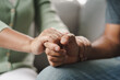 © Suriyawut - Female friend or family sitting and hold hands during cheer up to mental depress man, Psychologist provides mental aid to patient. PTSD Mental health concept.