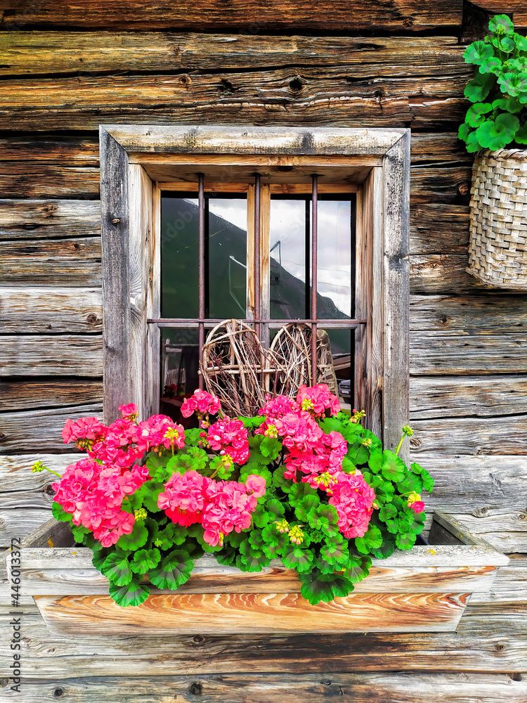 Wooden window with flowers in a house, Kaprun - Zell am see, Austria ...