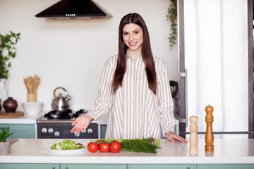 Poster - Photo of nice millennial lady cook dish wear white shirt at home kitchen alone