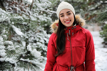 Sticker - Happy young woman outdoors on winter day. Space for text