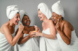 © Alessandro Biascioli - Happy multiracial women having skin care spa day - People selfcare concept