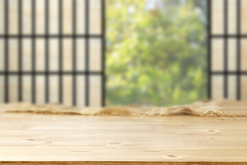 Wooden desk of free space and home interior with window 