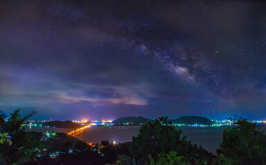 Wall Mural - on the viewpoint of khao kuti, ko yo, songkhla, thailand, the milky way in the clouds on songkhla la
