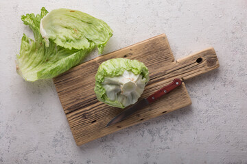 Wall Mural - White cabbage for salad on a cutting board, close up