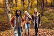 © Zoran Zeremski - Three female friends enjoying hiking in forest on a beautiful autumn day.