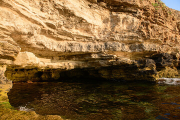 Wall Mural - Rocky coast of the sea in the evening