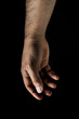 © Jonathan Reiss - man's hand on black background