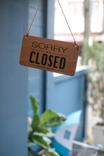 Sorry We Are Closed Sign Hanging Outside A Restaurant, Store, Office Or Other