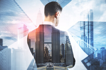 Poster - Back view of young businessperson standing on abstract city background with mock up place. Success and tomorrow concept. Double exposure.