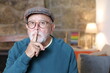 © ajr_images - Senior man asking for silence with gesture