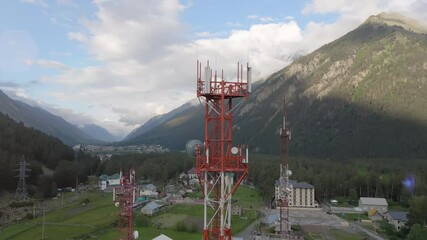 Wall Mural - Mobile telecommunication tower between mountains