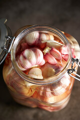 Wall Mural - Garlic Pickled in Vinegar Soy Sauce in Glass Bottles