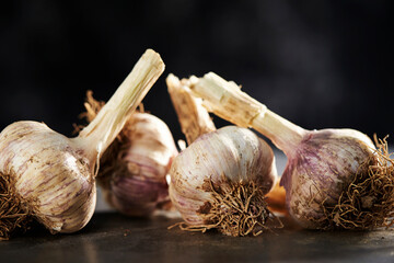 Wall Mural - garlic on a gray background 