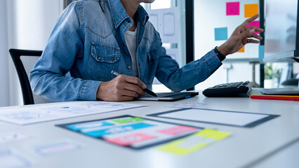 Creative Web Designer planning application and developing template layout, framework for mobile phone. User experience (UX) concept.