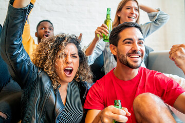 Wall Mural - Friends having good time while watching a match together.