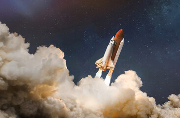 Wall Mural - Space shuttle launch in the clouds to outer space. Dark space with stars on background. Sky and clouds. Spaceship flight. Elements of this image furnished by NASA