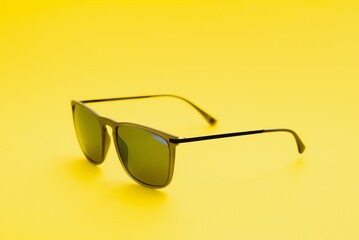 Wall Mural - Stylish sunglasses on a yellow background High quality photo Sunglasses.