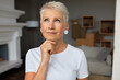 © Anatoliy Karlyuk - Pensive woman thinking about something looking up on sky. Middle aged female making plans, dreaming about holiday, meditate. Deep in thoughts, be present in moment concept