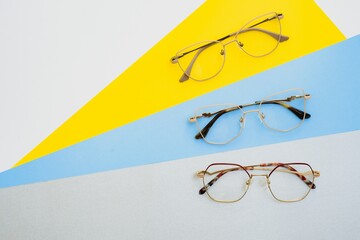 Stylish eyeglasses. Modern eyeglass frames on a colored background