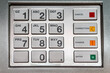 © powerbeephoto - Closeup of Modern Silver Metal ATM Keypad. Select focus