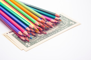 Wall Mural - set of colored pencils for drawing on a dollar background. sales marketing