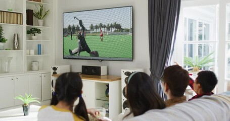 Canvas Print - Composite of happy family sitting at home together watching hockey match on tv