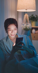 Poster - woman using phone at night