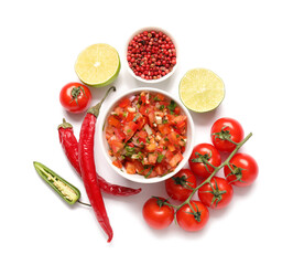 Wall Mural - Bowl of tasty salsa sauce and products on white background