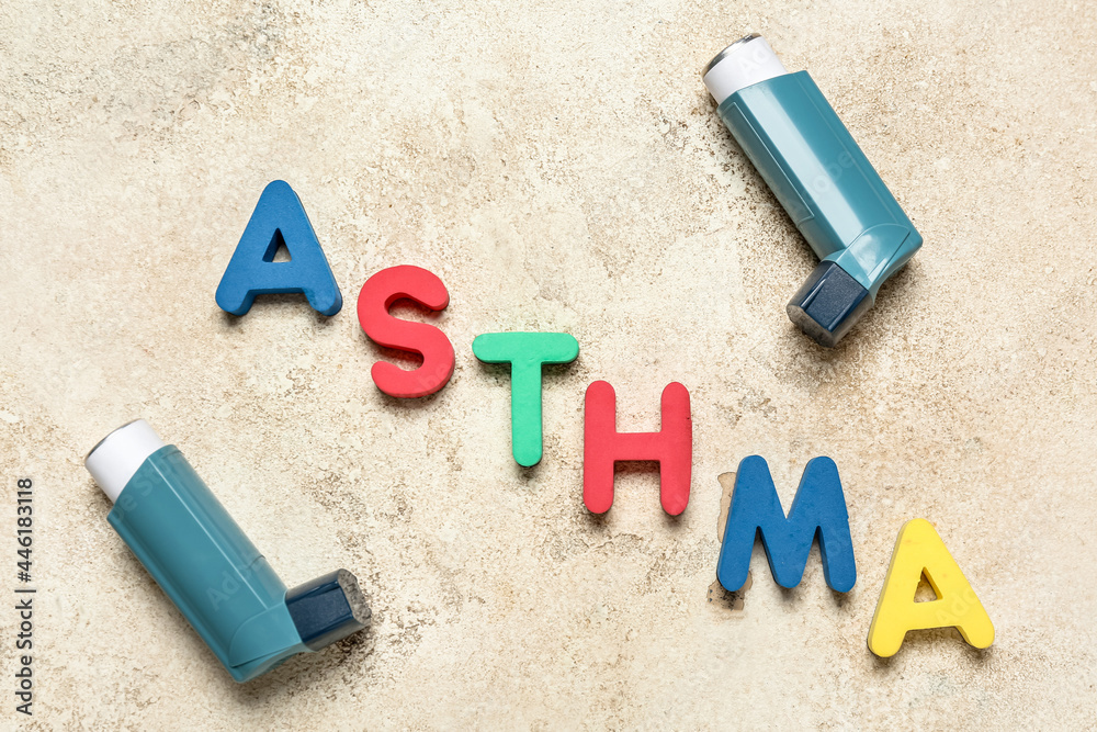Modern inhalers and word ASTHMA on grunge background Stock Photo ...