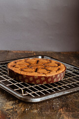 Canvas Print - Vertical shot of a tasty biscuit on a grey background