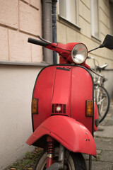 Canvas Print - Vertical shot of a red motorcycle on a street