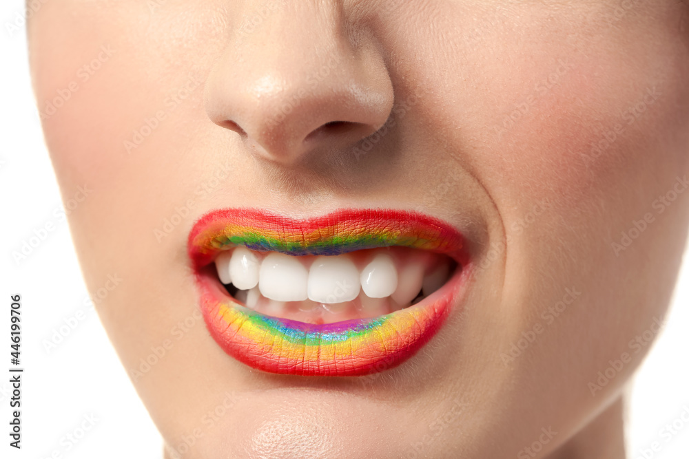 Beautiful young woman with rainbow lips, closeup