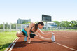 © Pixel-Shot - Sporty young woman training in the stadium