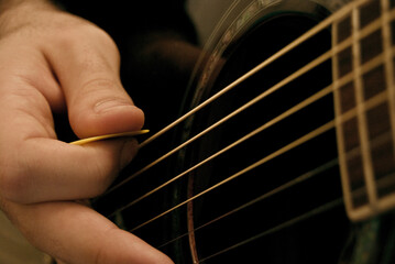 Sticker - Closeup shot of a man playing guitar