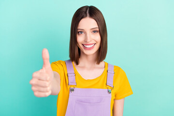 Wall Mural - Photo of charming cheerful happy pretty woman make finger thumb up recommend isolated on teal color background
