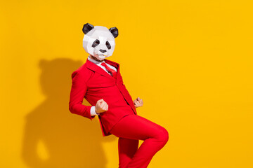 Poster - Photo of astonished triumphant guy rejoice wear panda mask red suit tie isolated on yellow color background