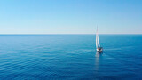 Aerial view of sailing luxury yacht at opened sea at sunny day in Croatia