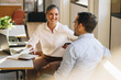 © Jacob Lund - Colleagues at desk discussing project