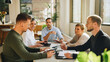 © Jacob Lund - Businessman sharing new business plan with team