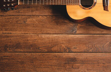 Classical Guitar On Wooden Background