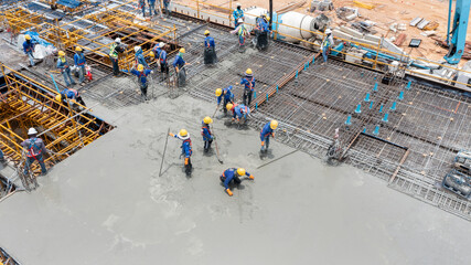 Canvas Print - construction worker pouring concrete by pumping