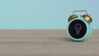 © Destrosvet - 3d rendering of color alarm clock with symbol of idea on display on table