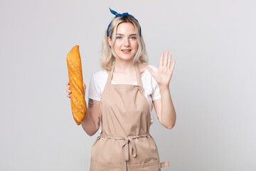 Wall Mural - young pretty albino woman smiling and looking friendly, showing number five with a bread baguette