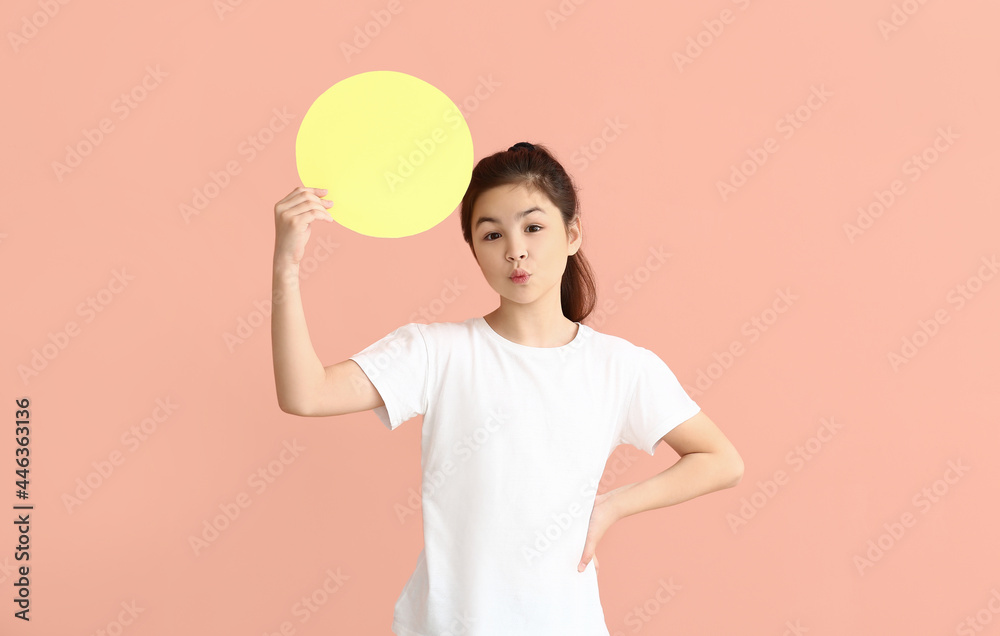 Little girl with blank paper sheet on color background