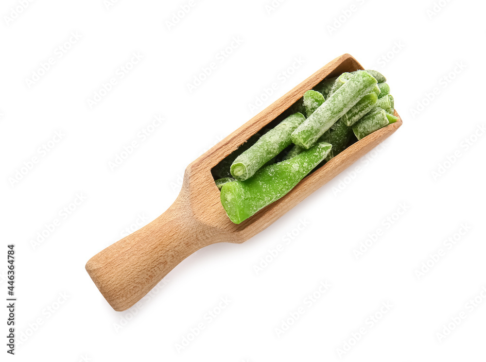 Scoop with frozen green beans on white background