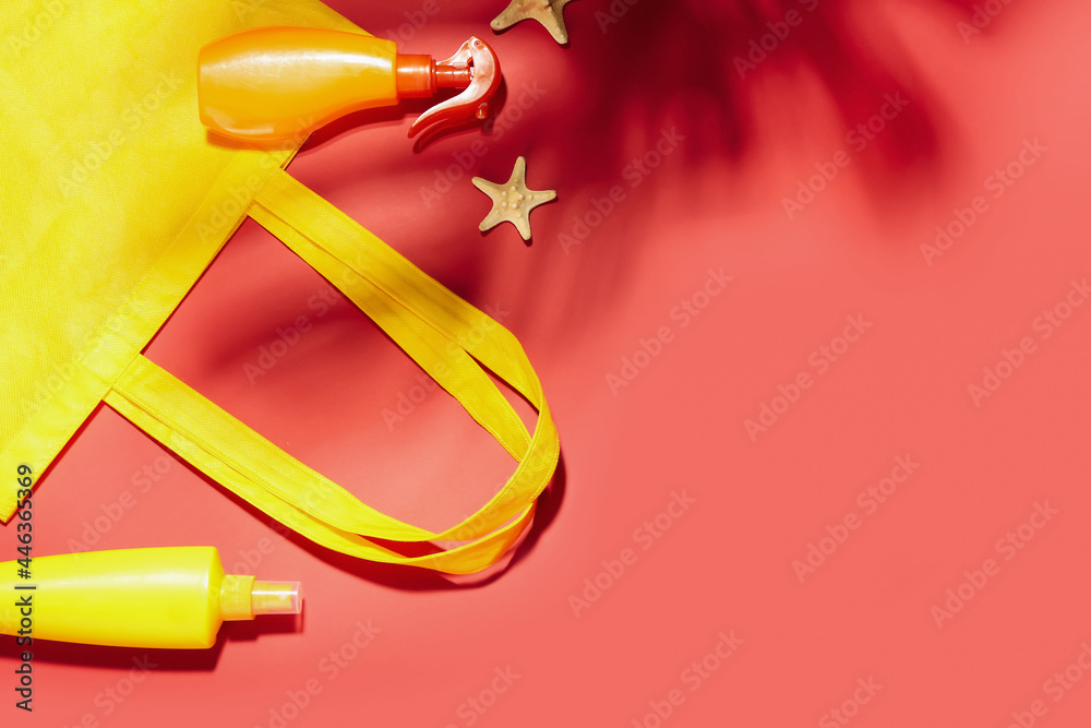 Stylish bag and sunscreen cream on color background