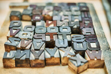 Collection Of Metal Letters And Numbers In Wooden Box