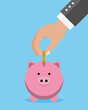 © sonia - Savings concept. Man hand putting coin into piggy bank. Isolated vector