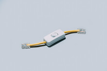 Network Cable With Switch Button Isolated On Grey Background