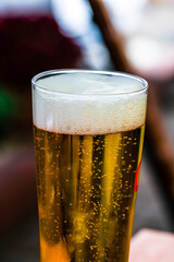 Poster - Selective focus shot of a glass of beer with scum